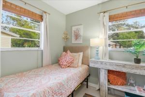 a bedroom with a bed and a fireplace at Crystal Blue Haven in Crystal River +34 photos