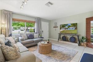 a living room with a couch and a fireplace at Crystal Blue Haven in Crystal River
