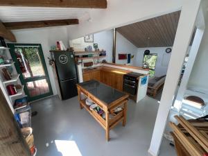 a kitchen with a black refrigerator and a stove at Medlands Retreat with Breathtaking Views in Medlands