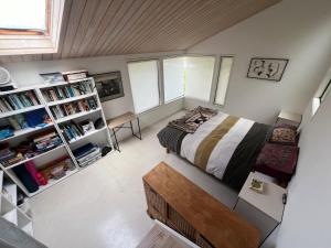 a bedroom with a bed and a book shelf at Medlands Retreat with Breathtaking Views in Medlands