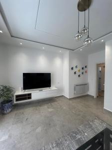 TV/trung tâm giải trí tại Luxueux Appartement Central Parc