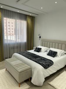 Giường trong phòng chung tại Luxueux Appartement Central Parc