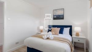 En eller flere senge i et værelse på The Den at the Harbour