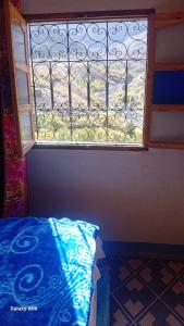 Una cama o camas en una habitación de Dar Agourzi Café des Epices