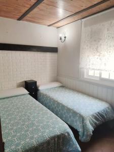 En eller flere senge i et værelse på Casa 318 by Villamya + 13 billeder