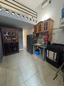 a kitchen with a counter and a stove in it at Casa Familia Mateo in Santa Teresita