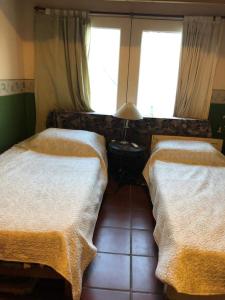 En eller flere senge i et værelse på Casa Alto Alberdi