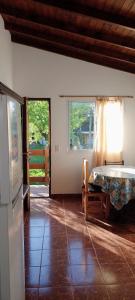 a bedroom with a bed in a room with windows at Luana2 in Villa Gesell