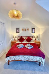 a bedroom with a large bed with two towels on it at Eden Gateway full equipment brand new bright and modern En-suite Double bedroom - room 3 near city centre in Birmingham