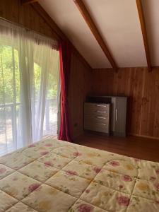 Postel nebo postele na pokoji v ubytování cabañas walls 1