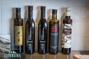 a group of wine bottles sitting on a counter at Hotel La Alfonsina in Santibáñez de Villacarriedo