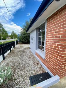 a brick building with graffiti on the side of it at The Batch in Lawrence