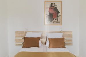 En eller flere senge i et værelse på Mieszkania w Browarze