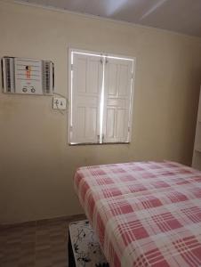 En eller flere senge i et værelse på Casa Praia Abais - Estância SE