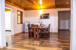 a dining room with a table and chairs at Fortbella Tourist Inn in Njara