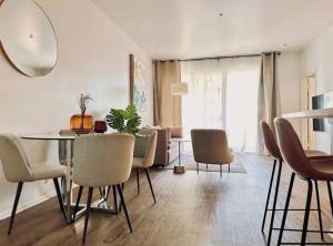 a living room with a dining room table and chairs at Marina Retreat, Near Beaches&SoFI in Los Angeles