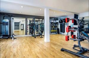 a gym with several tread machines in a room at Marina Retreat, Near Beaches&SoFI in Los Angeles