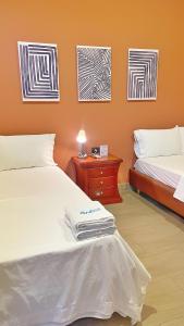 Postel nebo postele na pokoji v ubytování Awa House Hotel