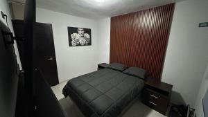 a bedroom with a bed in a room at Bonita casa de lujo in Ciudad Obregón