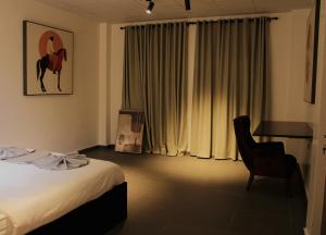 Postel nebo postele na pokoji v ubytování Urban Hotel Nouakchott + 49 fotografií