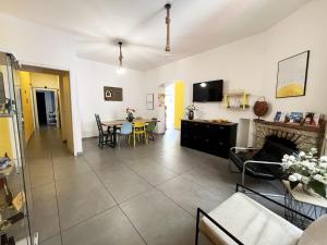 a living room with a couch and a table at Mira Vietri in Vietri sul Mare