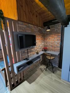 Телевизор и/или развлекательный центр в Casa da Lagoa - Gasthaus Pomerode