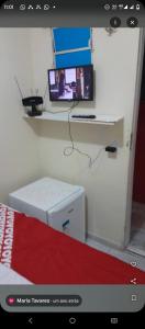 TV a/nebo společenská místnost v ubytování Pousada Lirios