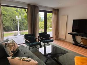 TV a/nebo společenská místnost v ubytování Janglida's Apartment