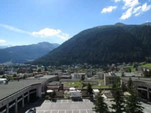 a view of a city with a mountain in the background at Holiday apartment Constantin in Davos +8 photos