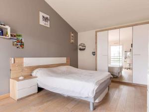 a bedroom with a bed and a large mirror at DUXCAAR Mervent in Mervent +23 photos