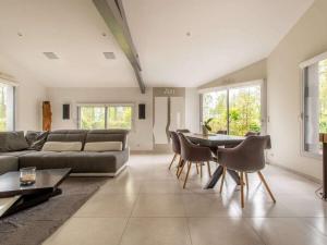 a living room with a couch and a table and chairs at DUXCAAR Mervent in Mervent