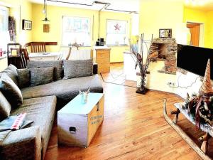 a living room with a couch and a table at Holiday apartment with 1 bedroom in Furth im Wald