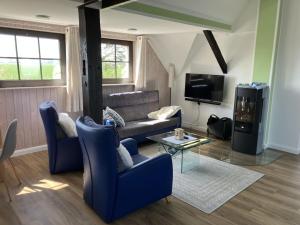 Μια τηλεόραση ή/και κέντρο ψυχαγωγίας στο Holiday apartment with 1 bedroom