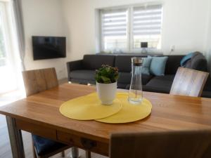 a table with a napkin and a vase on it at Apartment with 1 bedroom in Einruhr