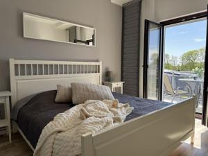 Кровать или кровати в номере Holiday apartment with 1 bedroom