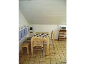 a dining room with a table and chairs at Holiday apartment in Rhön with 1 bedroom in Ehrenberg