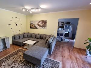 a living room with a couch and a table at Holiday home with 3 bedrooms in Fichtenwalde