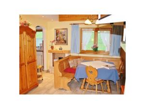 a kitchen with a table and a dining room at Untersberg in Punzenlehen in Engedey