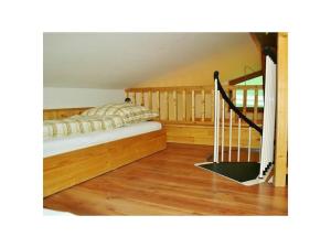 a bedroom with a bed and a stair case at Untersberg in Punzenlehen in Engedey +8 photos