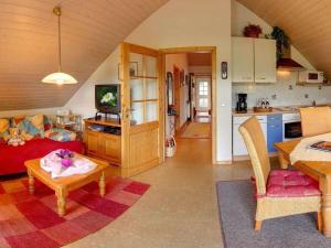 a living room with a couch and a table at Close-up view inside the Vorbek house in Bärenbach