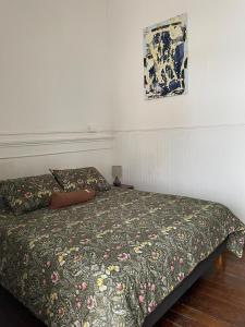 En eller flere senge i et værelse på Departamento Amoblado Ekeka House