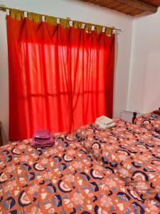 En eller flere senge i et værelse på Departamento Guadalupe