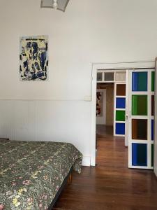 En eller flere senge i et værelse på Departamento Amoblado Ekeka House