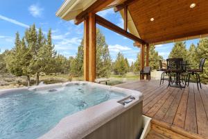 a jacuzzi tub on a wooden deck at High Lowe in Bend