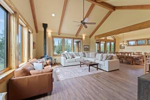 a large living room with couches and a table at High Lowe in Bend