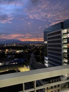 a view of a city at dusk from a building at Aspen Suites Condo in Davao City
