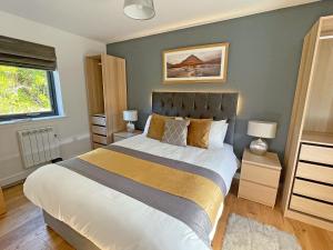 Ένα ή περισσότερα κρεβάτια σε δωμάτιο στο Riverview Lodge