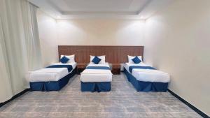 Una cama o camas en una habitación de فندق بسمة الوحدة