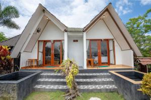 a house with stairs leading up to it at Break Villa Kintamani in Kintamani +20 photos