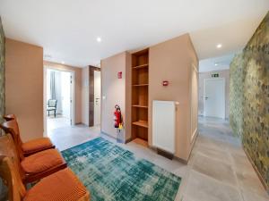 a room with a hallway with a couch and a chair at Luxury Stay La Croix Scaille in Bourseigne-Neuve +32 photos